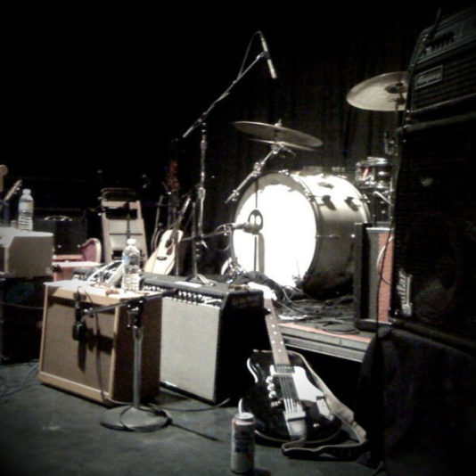 Instruments piled onstage.